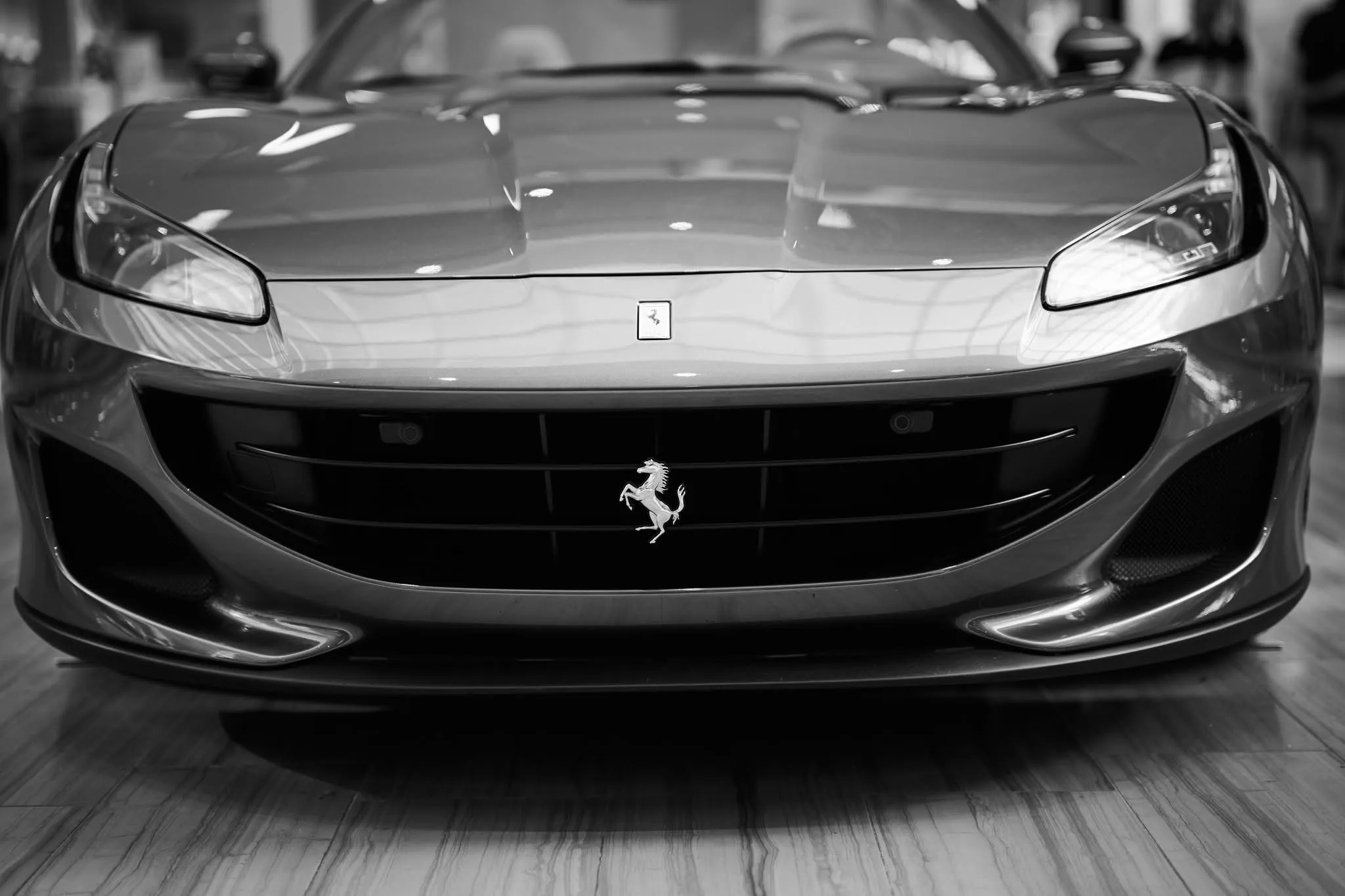 Black and white front study of a Ferrari