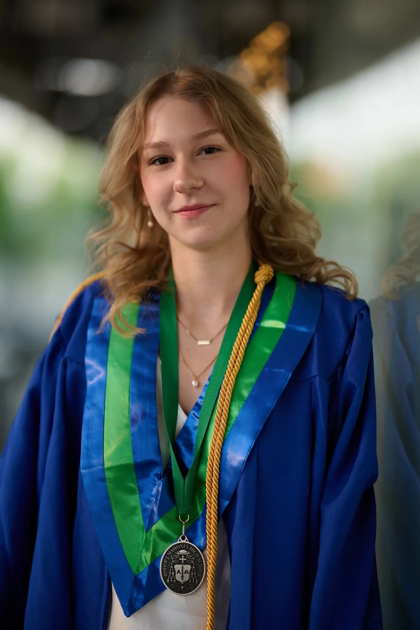Graduate framed by greenery