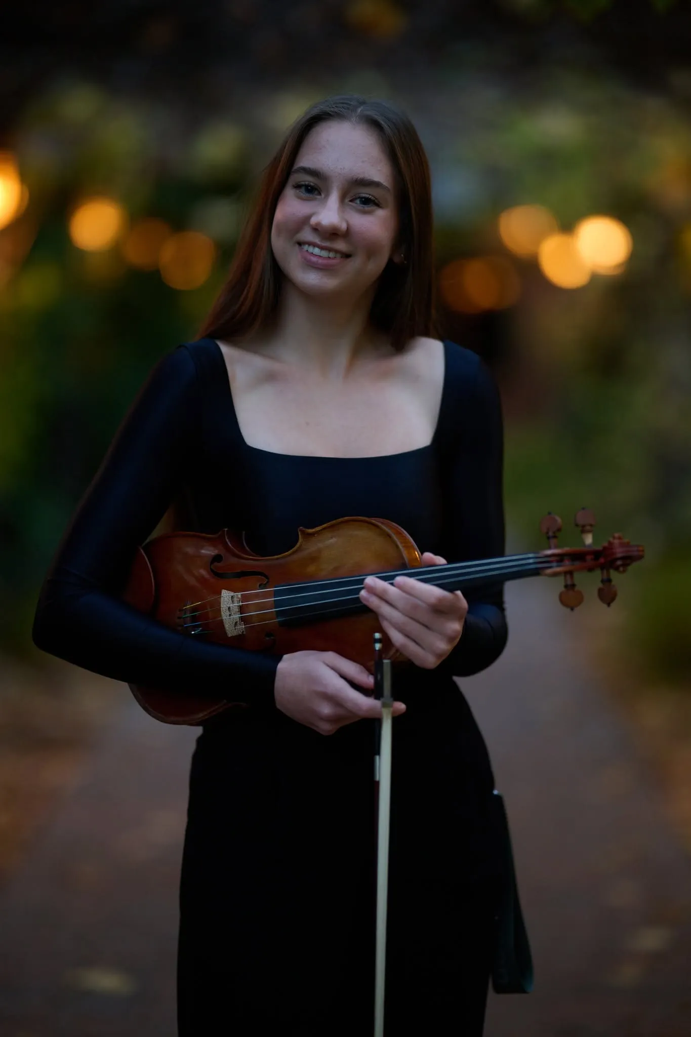Portrait of a violinist holding her bow